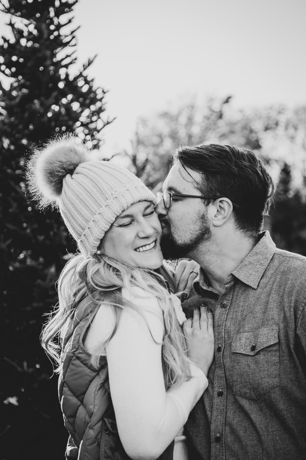 Intimate couple sharing tender moment during winter portrait session in Madison, Wisconsin
