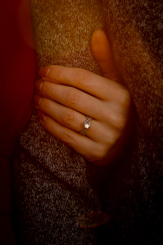 Intimate engagement ring detail captured in warm light during Madison, Wisconsin event photography session