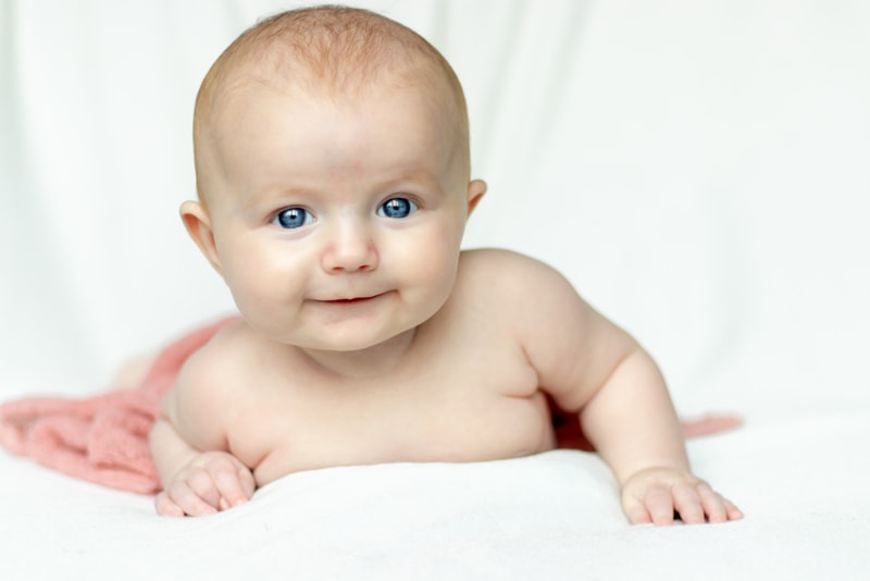 Bright-eyed baby milestone portrait capturing precious early months in Madison, Wisconsin studio photography session